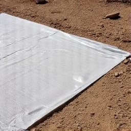 Ground preparation for gravel installation in Casas Adobes.