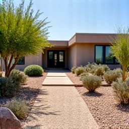 Desert landscaping front yard after completion with fresh rock and desert flora in Tucson