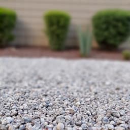 After: Beautifully leveled and refreshed gravel patio in Green Valley. The image showcases the transformed residential patio area in Green Valley, AZ, now featuring perfectly leveled and evenly distributed gravel, enhancing curb appeal.