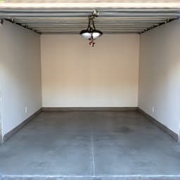 Clean and organized garage after estate cleanout in Oro Valley. This image shows a completely cleared garage, demonstrating the effectiveness of comprehensive estate junk removal services.