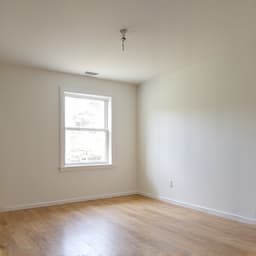 Cluttered room in a hoarder house before cleanout in Oro Valley. This image displays a room filled to capacity with items, highlighting the challenging nature of a hoarder cleanout.
