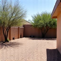 Residential Junk Removal in Tucson. A cleared residential backyard after furniture and general household junk removal, showing efficient and clutter-free results provided by professional junk hauling services.