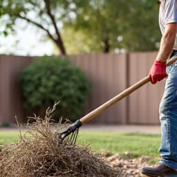 Yard cleanup crew working on monsoon debris removal in Marana. This image shows a dedicated crew efficiently clearing monsoon-related debris from a Marana residential property, highlighting their focused work during post-storm recovery efforts. 